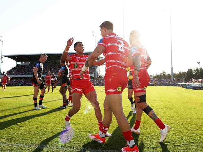 The Dragons celebrate Lomax’s try. Picture: Matt King/Getty Images