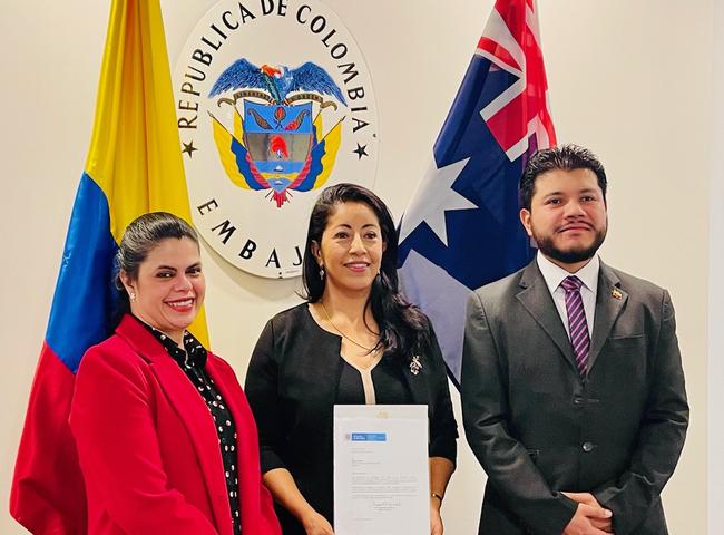 Giovanna Webb (centre) has been named the inaugural honorary Northern Territory Columbian Consul by Canberra Chargé d'Affaires of Colombia Diana Carvajal (left) and Colombia's Third Secretary (Consular Affairs) Javier Parada. Picture: Supplied