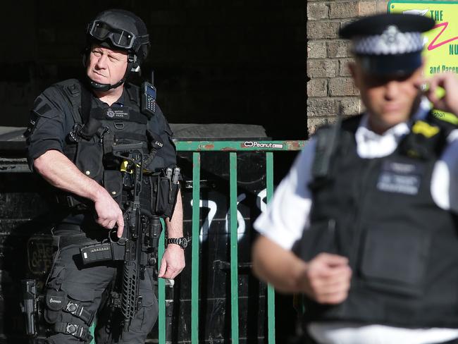 Armed British police officers stand on duty outside Parsons Green underground tube station in west London. Picture: AFP