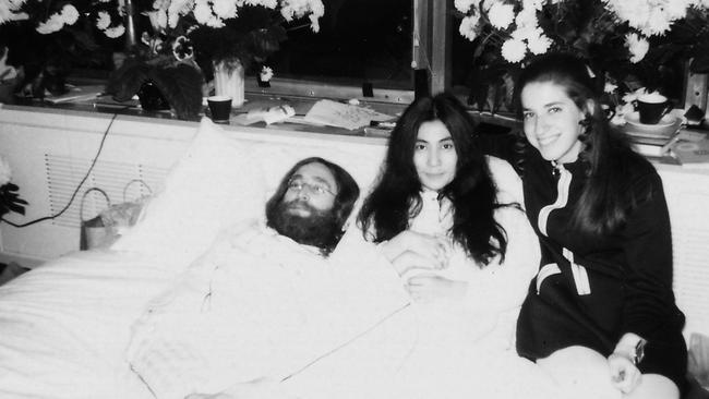 Late Beatle John Lennon (L) with his wife Yoko Ono (C) and Gail Renard during his 1969 "bed-in" in Montreal.