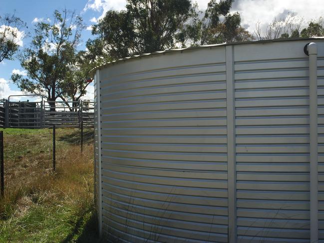 Large Australian tank catches rain water for household use. Device used for conserving water under drought conditions.