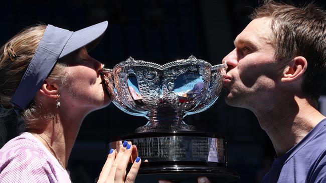 Aussies Olivia Gadecki (left) and John Peers celebrate with the mixed doubles championship trophy after beating John-Patrick Smith and Kimberly Birrell. Picture: David Gray / AFP