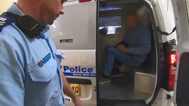 The former teacher being taken to Sutherland police station. Picture: NSW Police