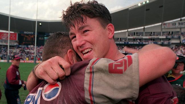 Mark Carroll celebrates winning the grand final.