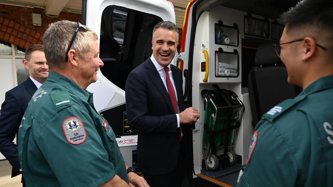 Premier Peter Malinauskas and Treasurer Stephen Mullighan speaking with SAAS paramedics Gary Fry and Quang Nguyen. Picture: NCA NewsWire / Naomi Jellicoe