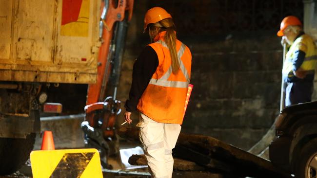 A worker takes a smoke break on the corner of Albion and Crown streets. Picture: Richard Dobson