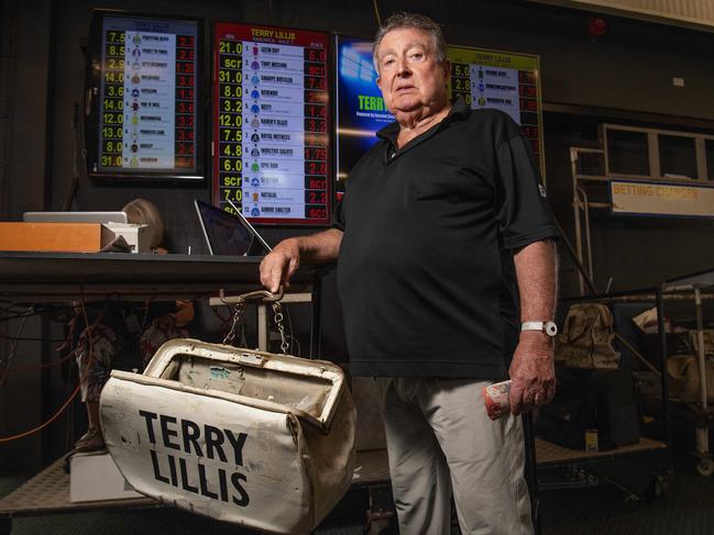 Bookmaker Terry Lillis with his betting board and bookies bag at Fannie Bay Racecourse, Saturday, July 6, 2019. Picture: Keri Megelus