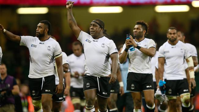 Fiji players salute the crowd at Millennium Stadium in Cardiff following their 23-13 loss to Wales.