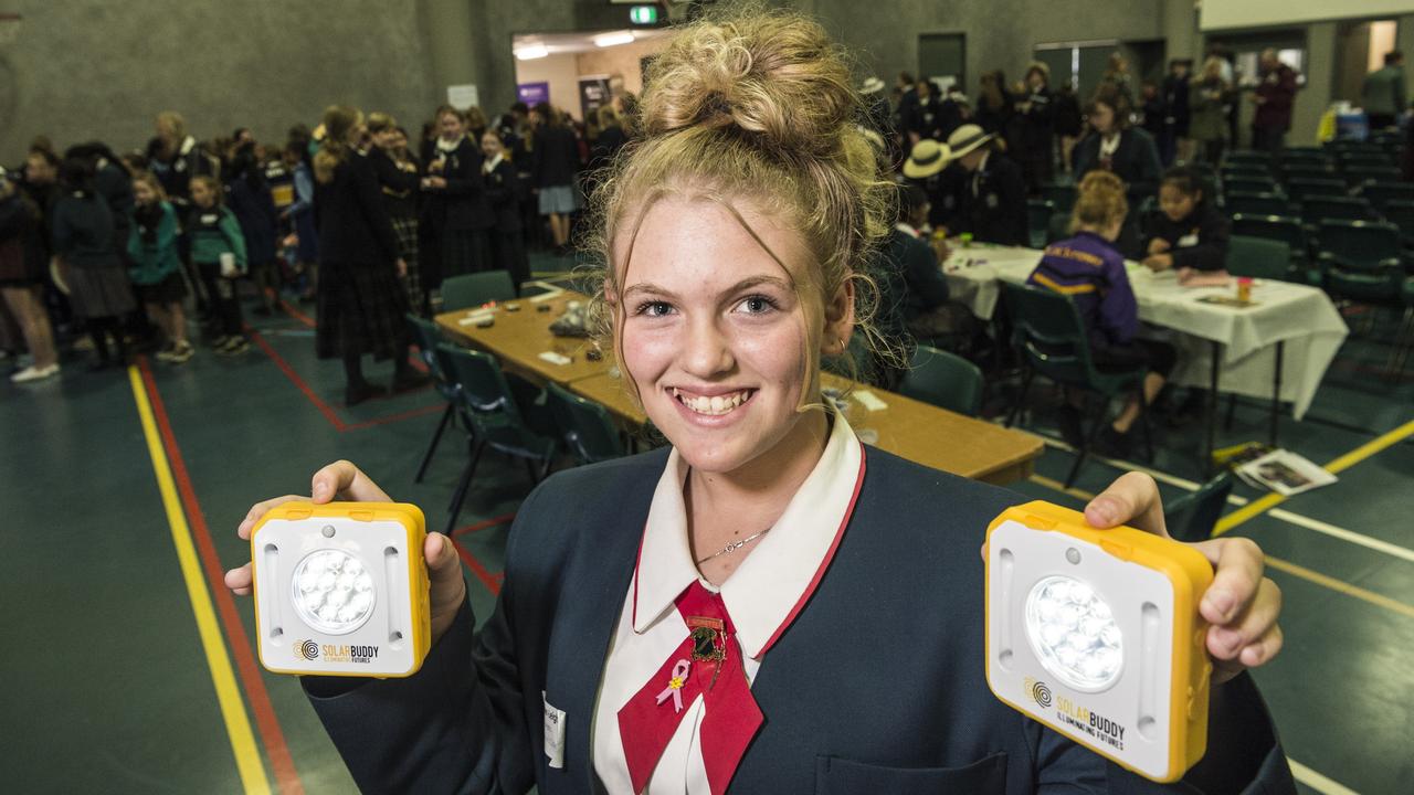 St Saviour's College student Esther-Leigh Watts with SolarBuddy lights, designed for communities living in energy poverty, at the It Takes a SPARK! STEM conference hosted by St Saviour's College. Picture: Kevin Farmer