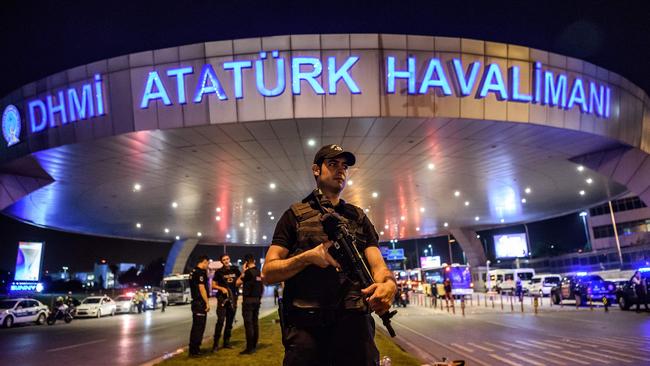 A Turkish riot police officer patrols Ataturk airport`s main entrance in Istanbul after the attack. Picture: Ozan Kose/AFP