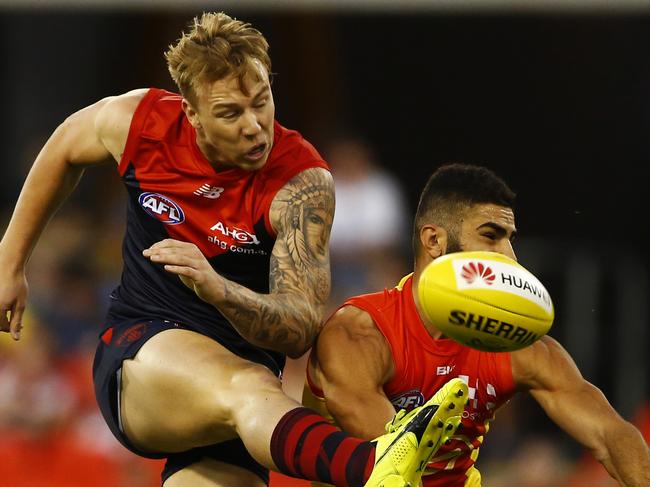 James Harmes of the Demons gets a kick away during the round 7 AFL match between the Gold Coast Suns and the Melbourne Demons at Metricon Stadium in Carrara on the Gold Coast, Saturday, May 7, 2016. (AAP Image/Jason O'Brien) NO ARCHIVING, EDITORIAL USE ONLY