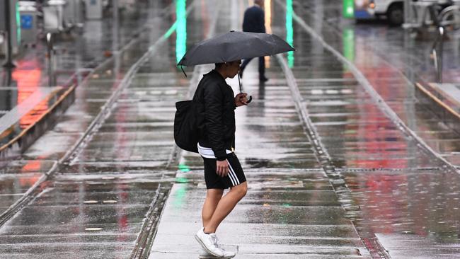 Queensland tourism bosses want to ban the word ‘rain’ from weather forecasts. Picture: AAP Image/James Ross.