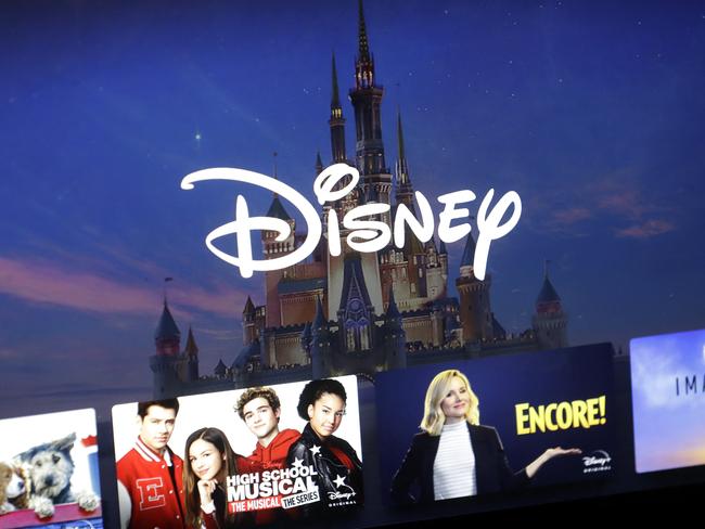 a Disney logo forms part of a menu for the Disney Plus movie and entertainment streaming service on a computer screen in Walpole, Mass., Wednesday, Nov. 13, 2019. Disney Plus says it hit more than 10 million sign-ups on its first day of launch, far exceeding expectations. (AP Photo/Steven Senne)