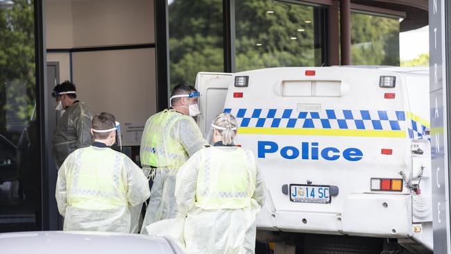 A man is transferred to the Fountainside Accommodation in Hobart. Picture Eddie Safarik