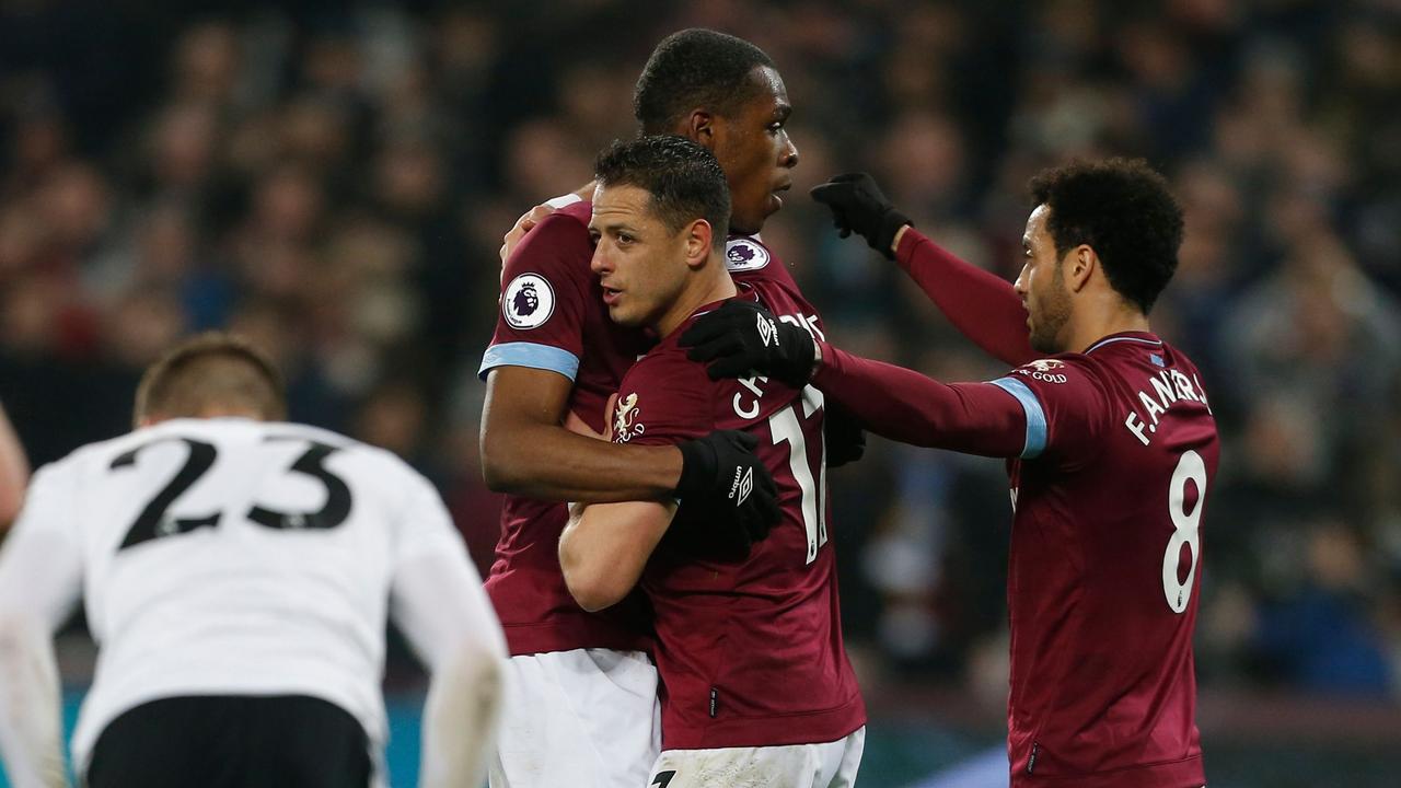 West Ham United's Mexican striker Javier Hernandez (C) celebrates after scoring.