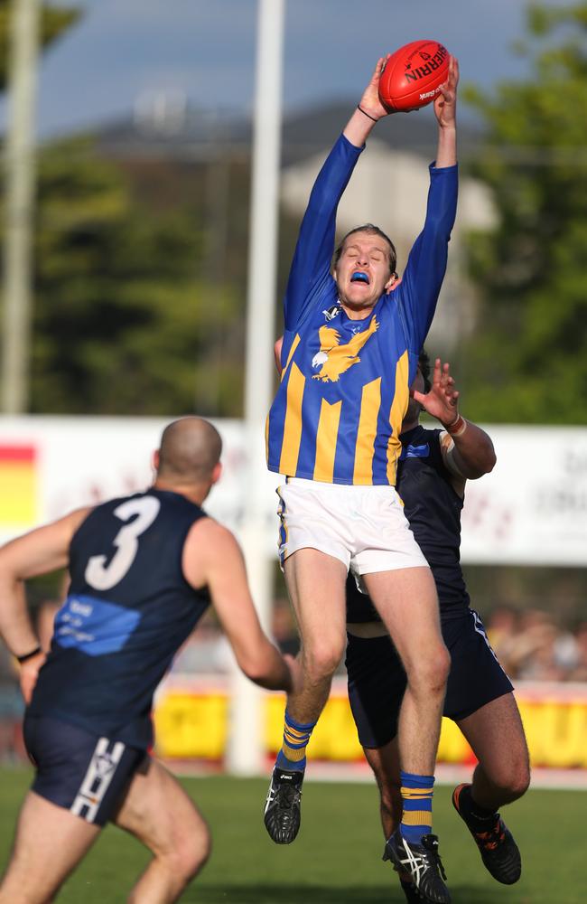 Somerville's Luke Rowe takes a strong contested mark. Picture: David Trend