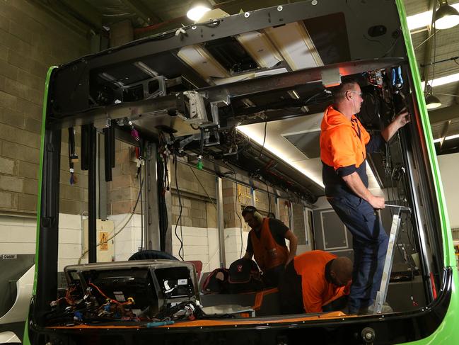 Joe working on construction of buses for Japan at Volgren in Dandenong. Picture: Hamish Blair
