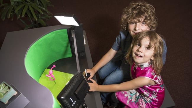 Elliot and Ella Caldwell make a stop motion film in the Garden of Curiosity. Picture: Kevin Farmer