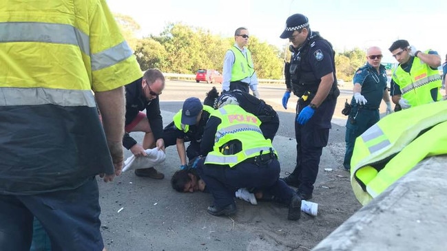 The driver of the van being restrained by police. Picture: Gary Jackson