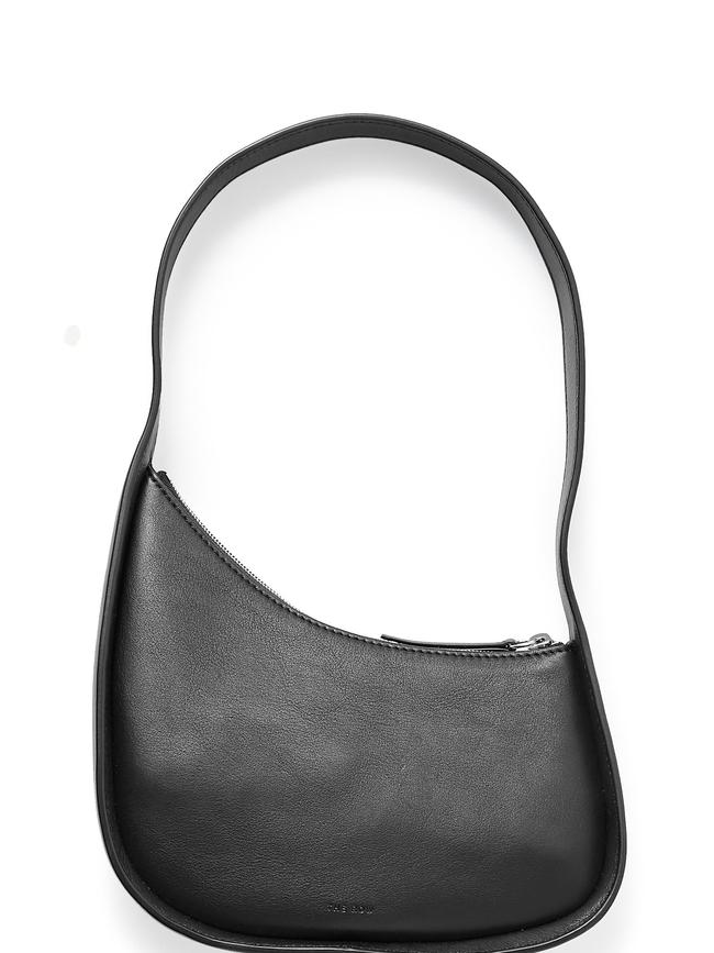 The Row Half Moon baguette calfskin shoulder bag.