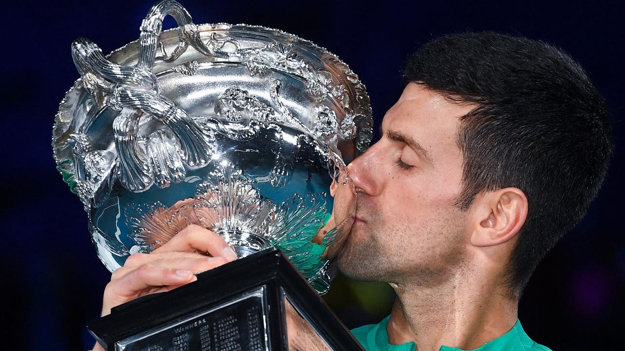 Serbia's Novak Djokovic kissing the Norman Brookes Challenge Cup trophy