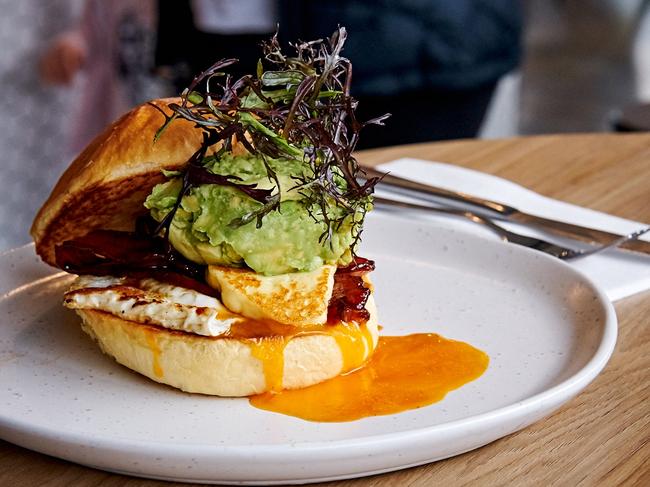 The brioche bun with fried egg, halloumi, bacon and avo.