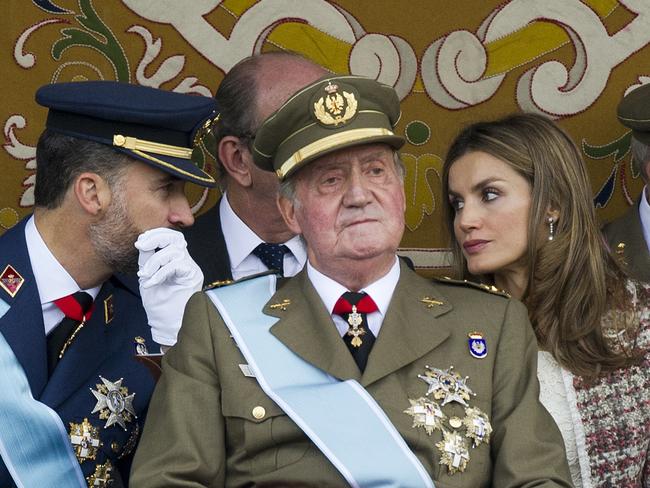 Then king Juan Carlos, centre, his son Felipe, the current King of Spain, and his wife, Queen Letizia, attend the Spanish National day military parade in Madrid in 2012. Picture: AFP