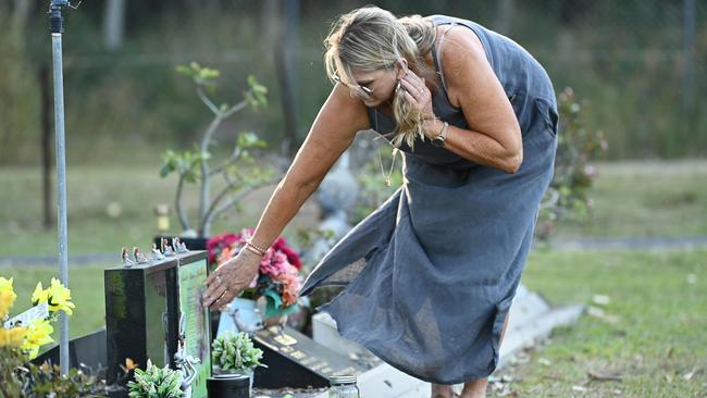 Murder victim Shandee Blackburn’s mother, Vicki, lays flowers at her daughter’s grave in Mackay, Queensland. Picture: Lyndon Mechielsen