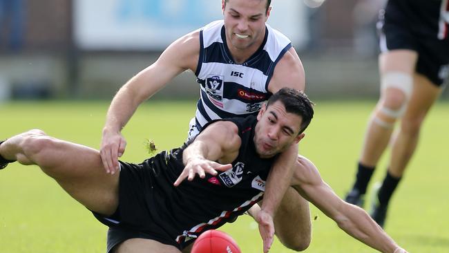 Frankston Dolphins player Ben Cavarra (front) goes all out to win the ball ... the club is now fighting for survival. Picture Yuri Kouzmin