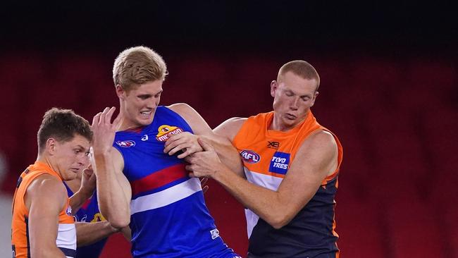 Tim English of the Bulldogs and Sam Jacobs of the Giants compete for the ball during the round three AFL match between Western Bulldogs and GWS Giants. Pic: AAP/Scott Barbour.