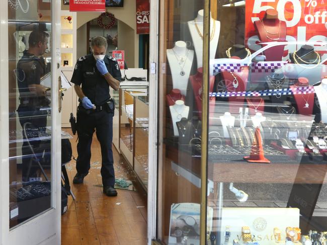 Police at the scene of the H&H Jewellery store robbery. Picture: David Crosling