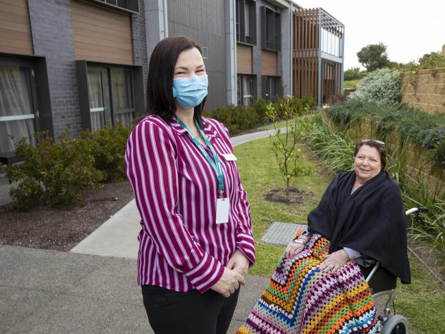 Clinical care co-ordinator Lauren Smith with Bev Wright, one of the aged care residents, of Whiddon Community Care in the courtyard of the new aged care facility. Picture: Peter Stoop,