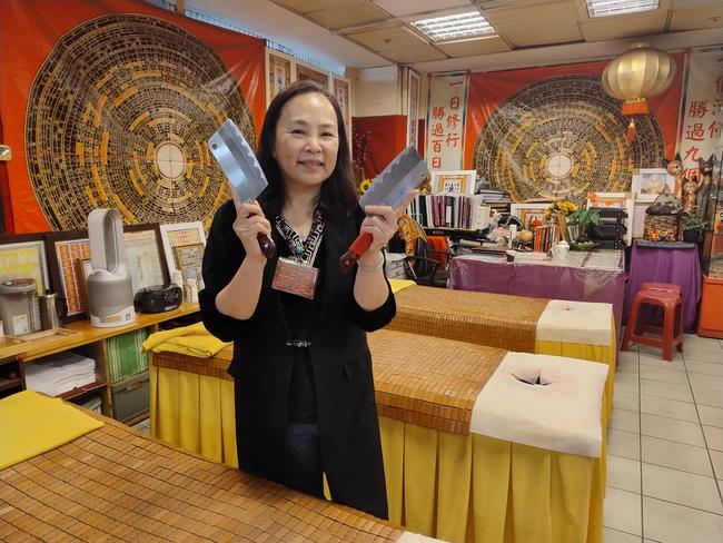 An eager practitioner of the cleaver massage in Taipei City Mall, Taiwan. Picture: Fiona Harari