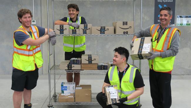 Staff at the new Central Coast Amazon distribution centre at West Gosford (L-R) Harry Hampton, Arden Cannone, Joshua Gabriel and Antonio Das Neves. Picture: NewsLocal