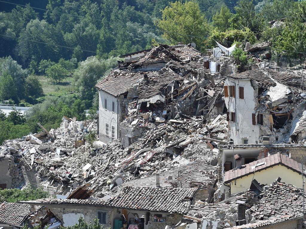 PESCARA DEL TRONTO, ITALY - AUGUST 25: Rubble surrounds damaged buildings on August 25, 2016 in Pescara del Tronto, Italy. The death toll in the 6.2 magnitude earthquake that struck around the Umbria region of Italy in the early hours of Wednesday morning has risen to at least 247 as thousands of rescuers continue to search for survivors. (Photo by Giuseppe Bellini/Getty Images)