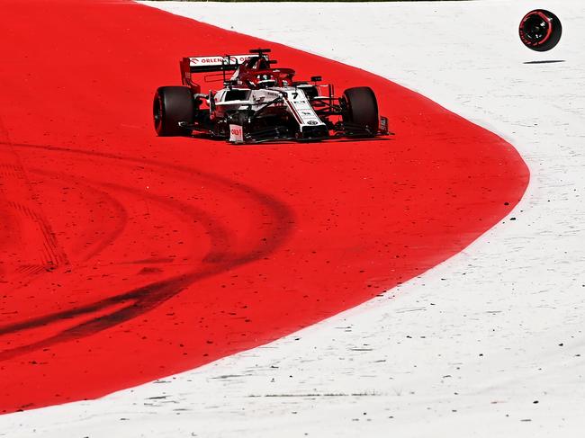 Alfa Romeo's Finnish driver Kimi Raikkonen looses his front wheel.