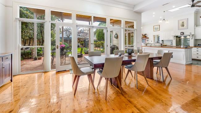 The light-filled large living and dining area has views of the landscaped garden.