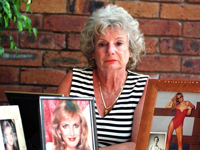 Dawn Leyden with photos of her murdered daughter Jacqueline Leyden.