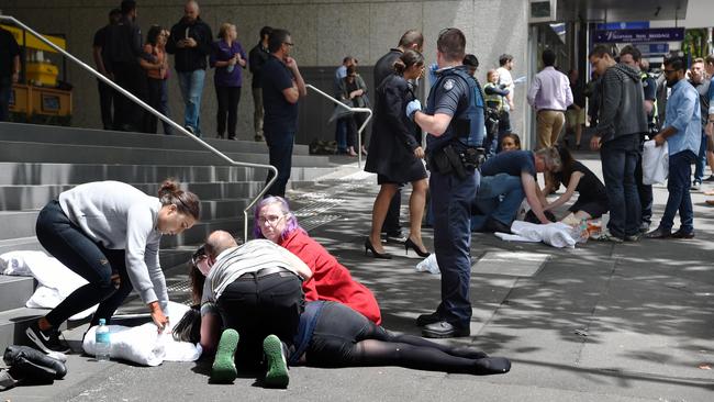 Those who witnessed the horror rushed to help as people lay motionless on the footpath. Picture: Tony Gough