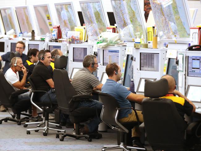 26/3/2019: Air traffic controllers in the main control room, under the control tower  Airservices Australia, at  Brisbane Airport . Lyndon Mechielsen/The Australian