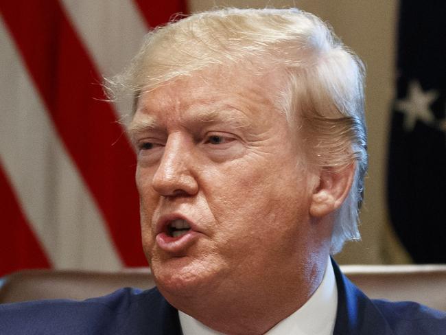 President Donald Trump speaks during a Cabinet meeting in the Cabinet Room of the White House, Tuesday, July 16, 2019, in Washington. Trump is accompanied by Secretary of State Mike Pompeo, left, and acting Defense Secretary Richard Spencer. (AP Photo/Alex Brandon)