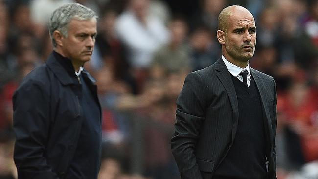 Jose Mourinho (L) and Manchester City's Spanish manager Pep Guardiola.