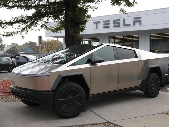 CORTE MADERA, CALIFORNIA - DECEMBER 20: A Tesla Cybertruck is displayed at a Tesla dealership on December 20, 2024 in Corte Madera, California. Electric car maker Tesla is recalling 700,000 vehicles over a tire pressure warning system that could fail to warn drivers of low tire pressure. 2024 Cybertrucks, 2017-2025 Model 3 and 2020-2025 Model Y are being recalled.   Justin Sullivan/Getty Images/AFP (Photo by JUSTIN SULLIVAN / GETTY IMAGES NORTH AMERICA / Getty Images via AFP)