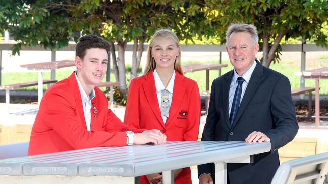 A photo taken in February 2020 after Benowa State High School topped the state with their OP results. Principal Mark Rickard with school captains at the time Matthew Coombes and Jemma Davey. AAP Image/Richard Gosling