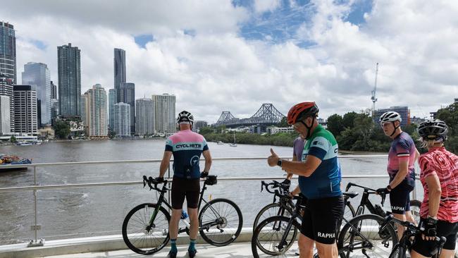 Cyclists at the opening of the Kangaroo Point Bridge in Brisbane. Picture Lachie Millard