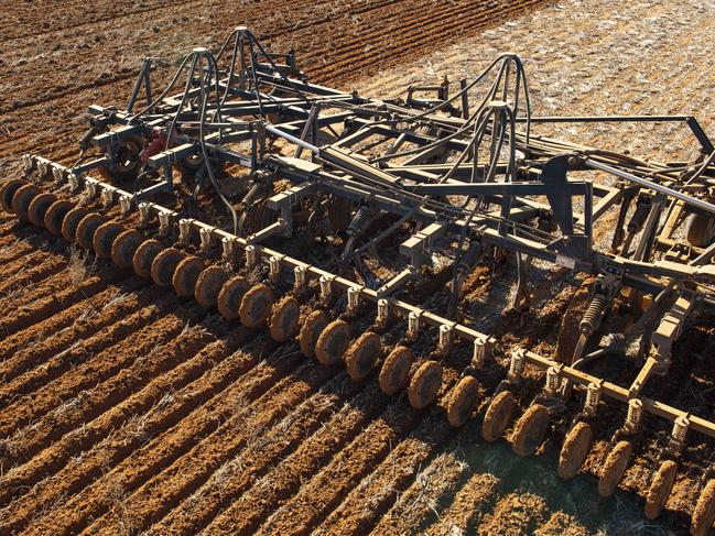 CROPS: Eddie Rickard at CuryoEddie Rickard at Curyo with his Kelpie pup named Louie.PICTURED: Generic sowing, seeding, crops, farm machinery, seeder.PHOTOGRAPHER: ZOE PHILLIPS