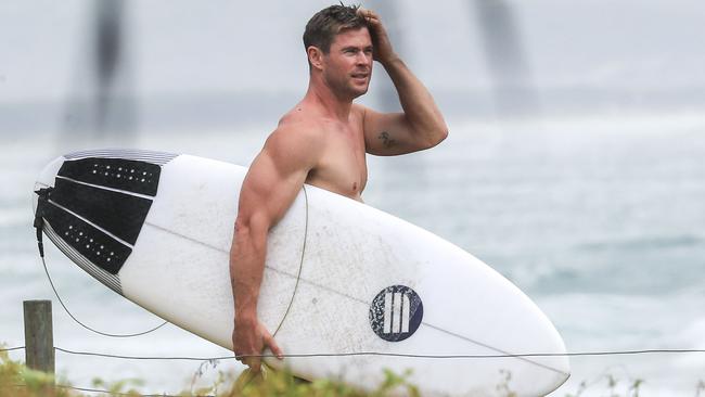 Chris Hemsworth taking a surf at Byron Bay before travelling to the United States. Picture: Media-Mode