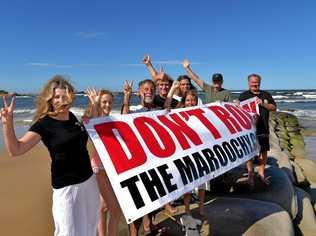 HARD FOUGHT: Local residents celebrate the decision not to build a rock wall on the Maroochy River. Picture: Warren Lynam