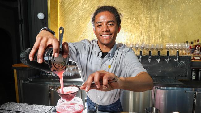 Hotel bar worker Reagan makes a cocktail at the Voco Hotel as the hotel industry starts to boom again. Picture: Brendan Beckett