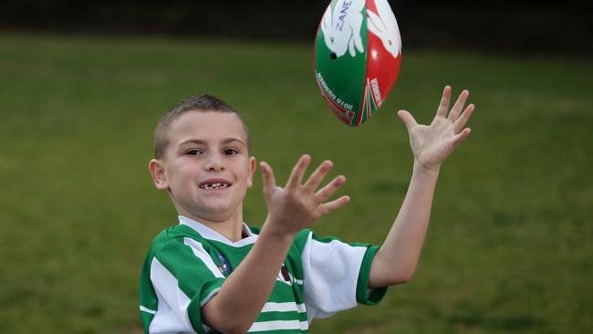 Zane Greenhalgh, 8, is a star footy player at the Randwick Coogee Wombats. Picture: AAP Image/Craig Wilson